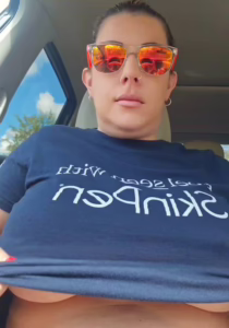 Big boobs coming out in parking lot